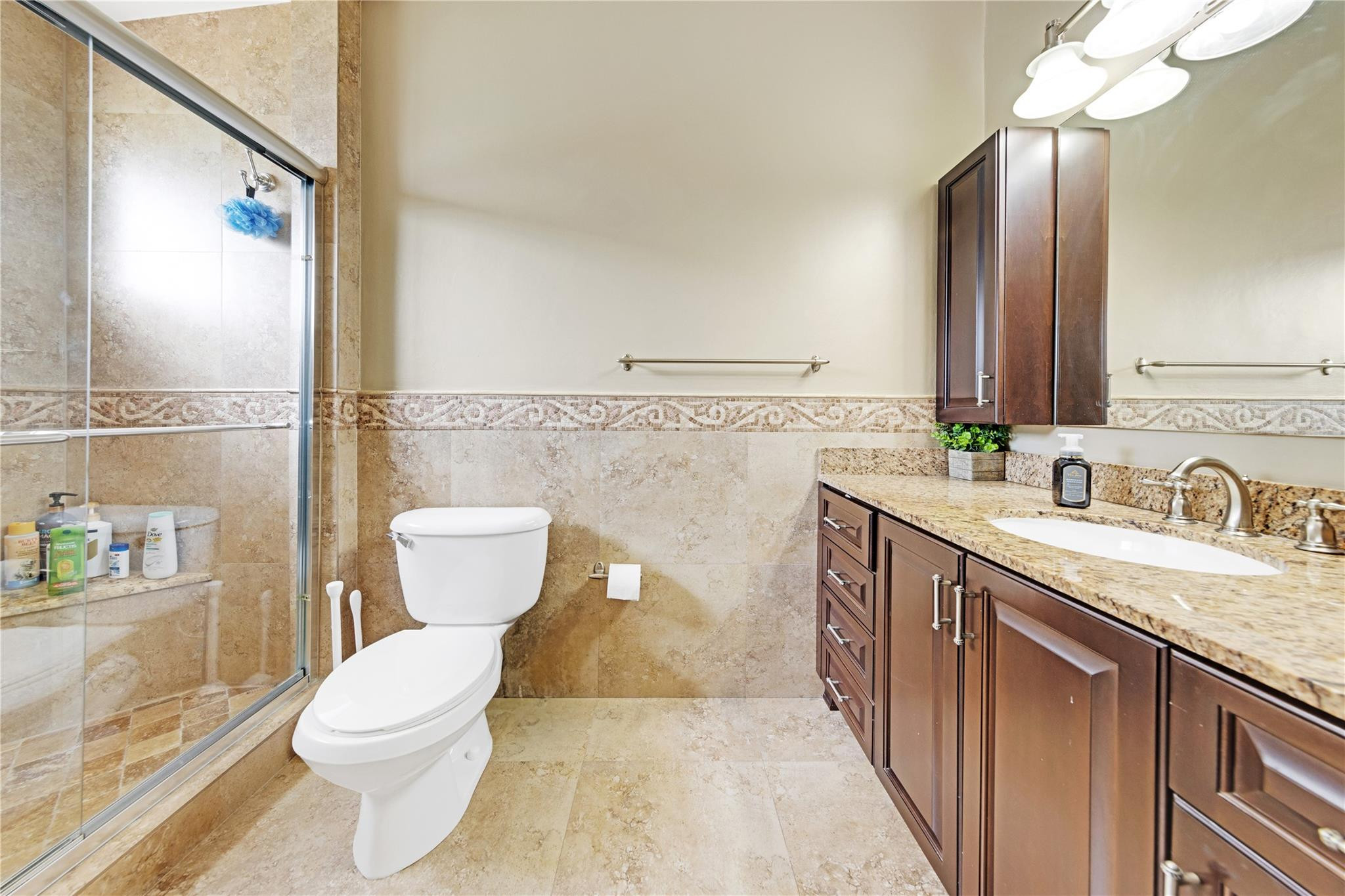 8310 Via Leonessa Boca Raton, FL 33433 - Photo 12 of 29 a bathroom with a granite countertop toilet sink and a mirror