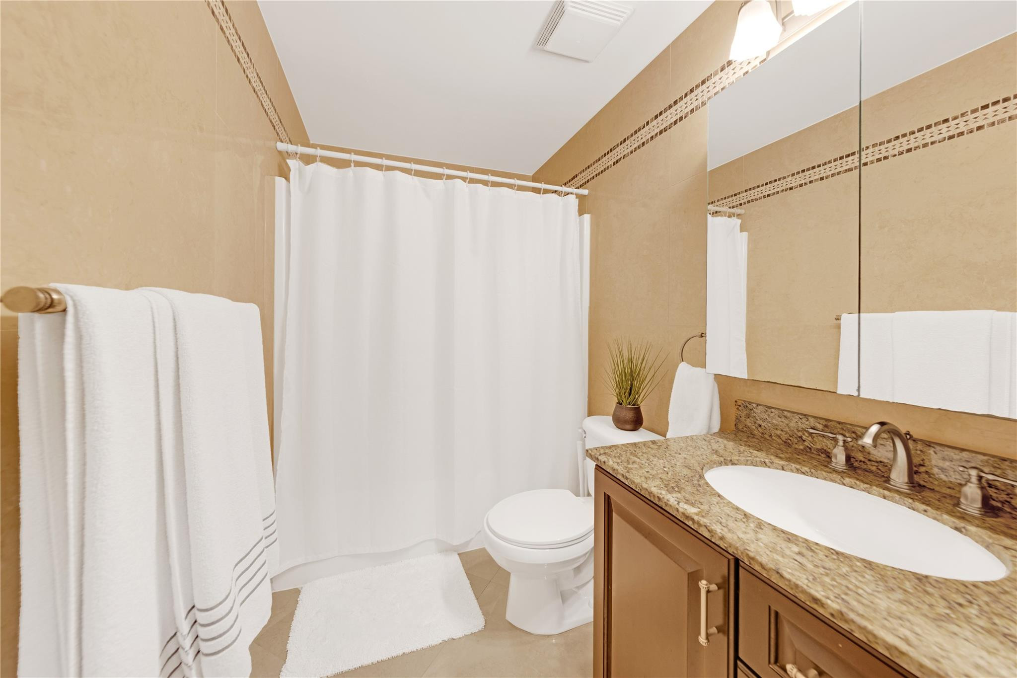 8310 Via Leonessa Boca Raton, FL 33433 - Photo 13 of 29 a bathroom with a granite countertop sink toilet and shower