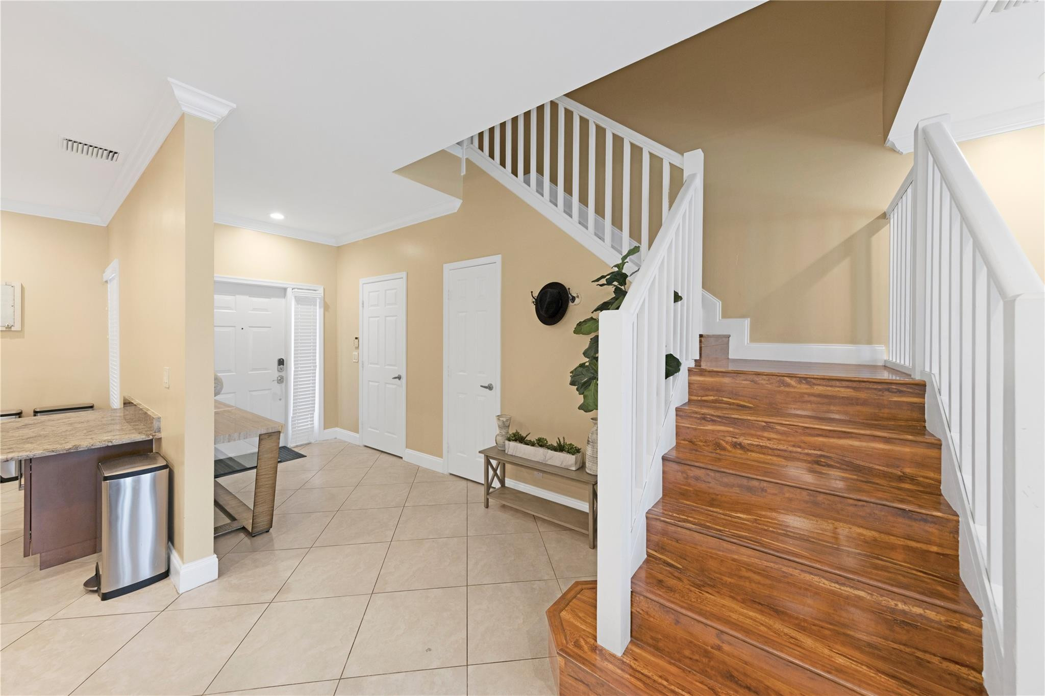 8310 Via Leonessa Boca Raton, FL 33433 - Photo 14 of 29 a view of entryway and hall with wooden floor