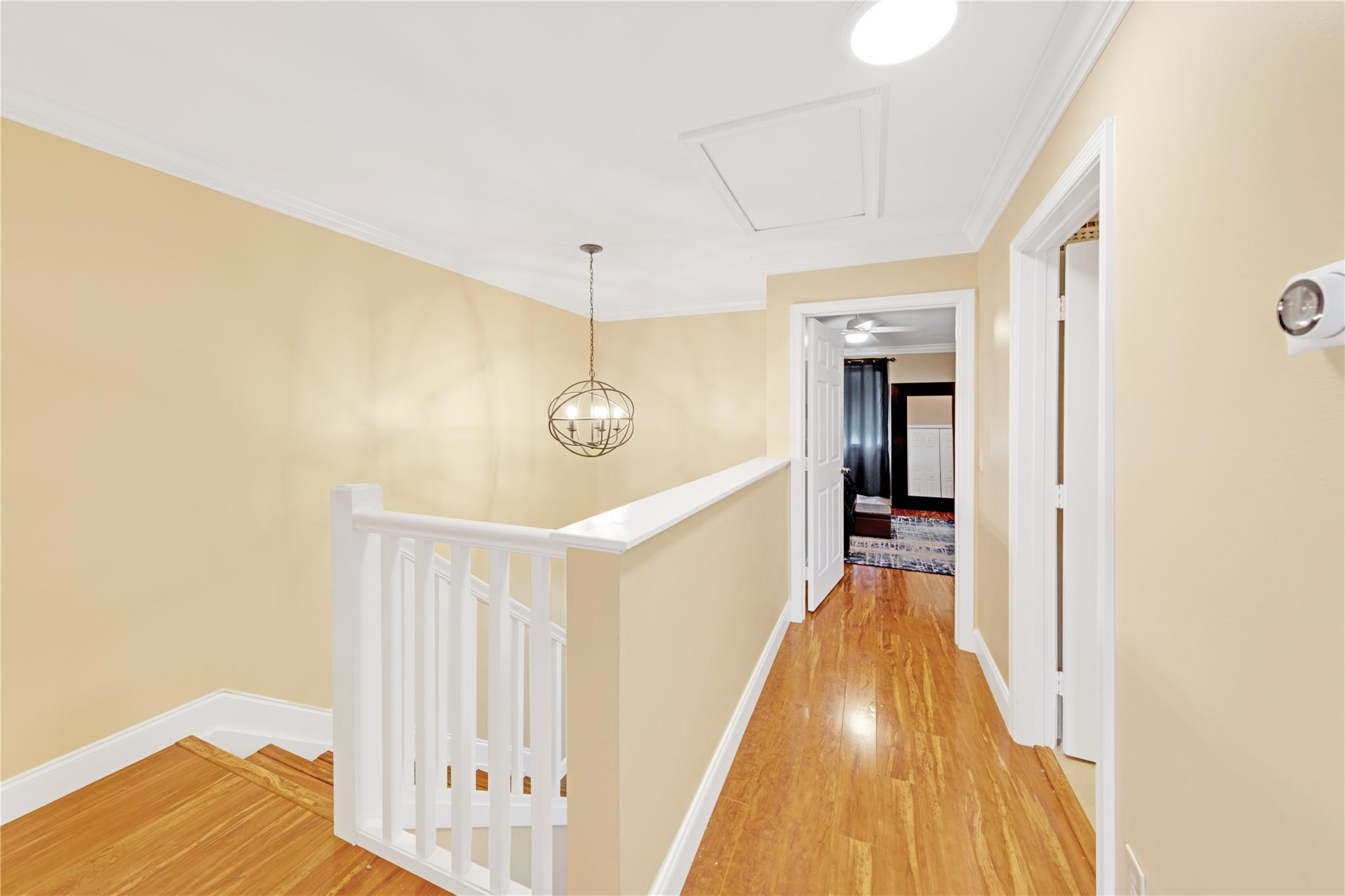 8310 Via Leonessa Boca Raton, FL 33433 - Photo 16 of 29 a view of a hallway with wooden floor and staircase