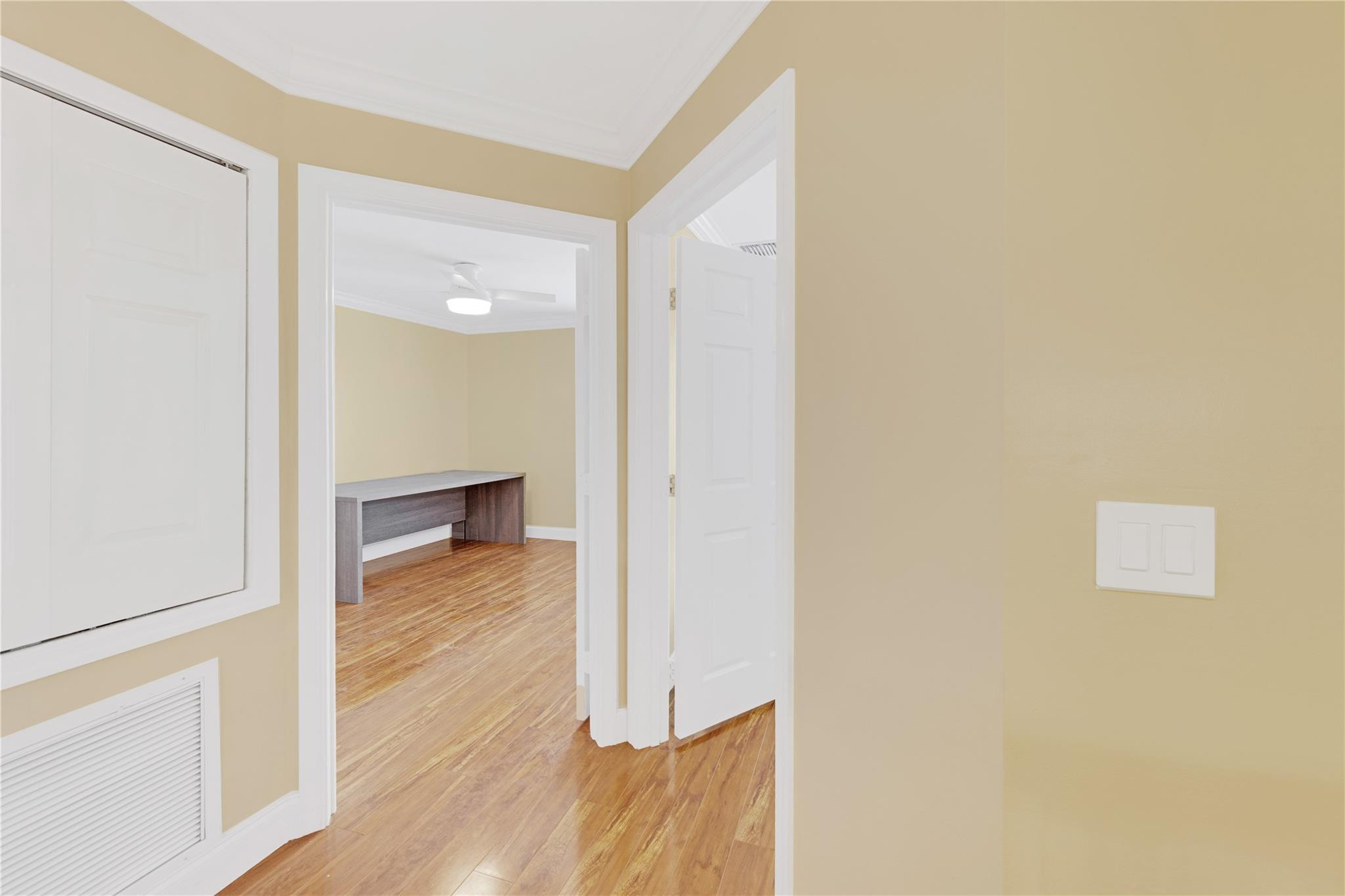 8310 Via Leonessa Boca Raton, FL 33433 - Photo 17 of 29 a view of a hallway with wooden floor