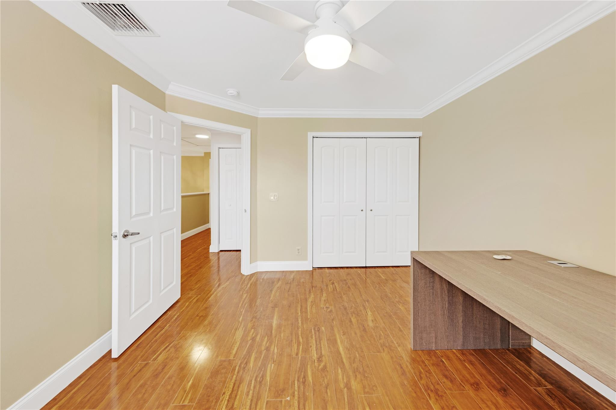 8310 Via Leonessa Boca Raton, FL 33433 - Photo 19 of 29 a view of an empty room with wooden floor