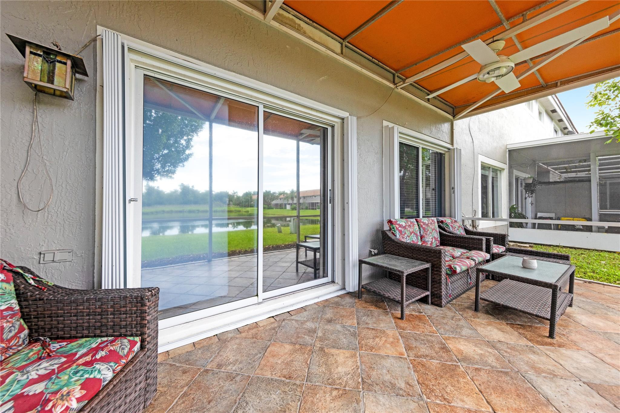 8310 Via Leonessa Boca Raton, FL 33433 - Photo 22 of 29 a outdoor space with lots of furniture and a couch