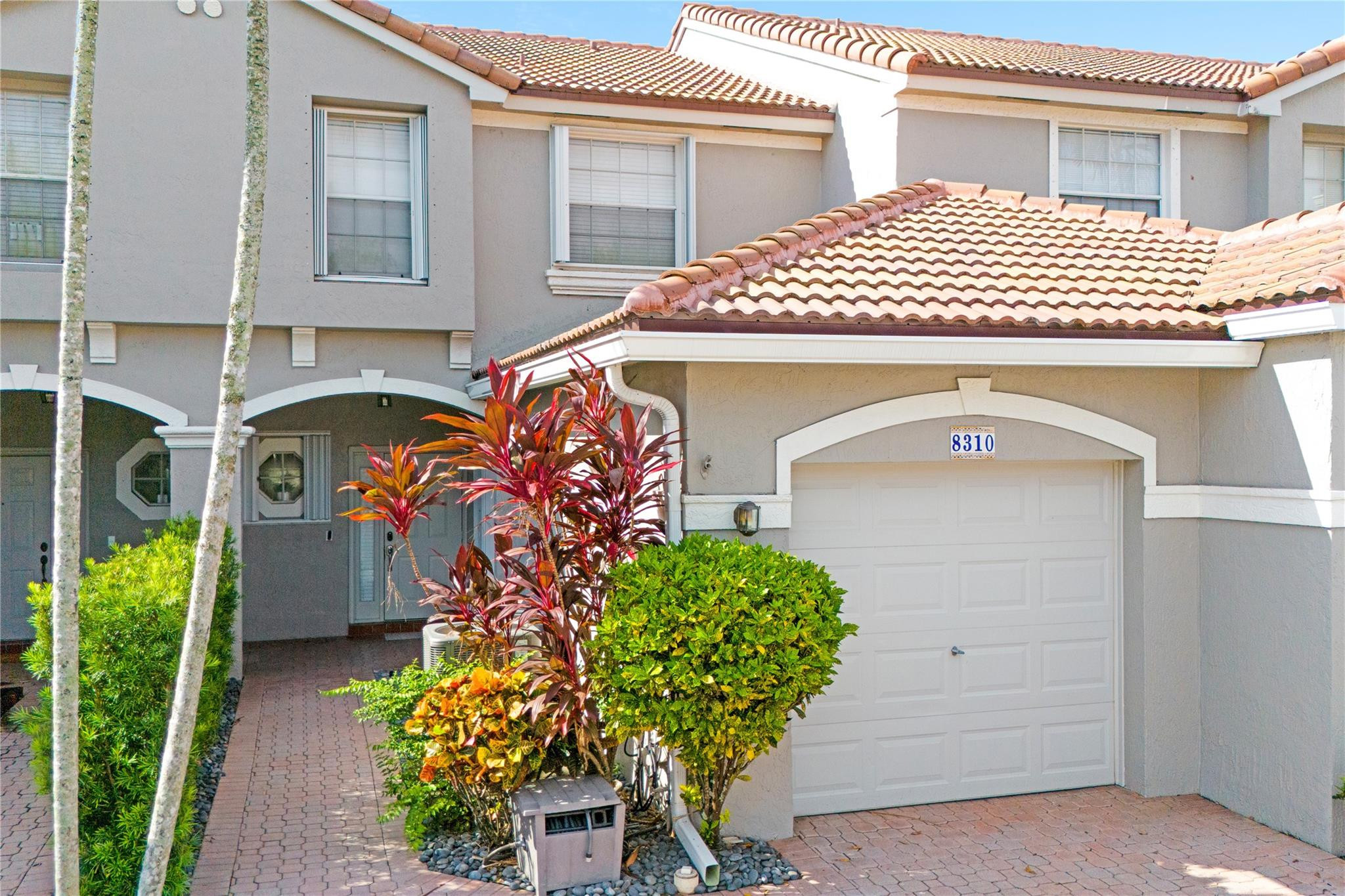 8310 Via Leonessa Boca Raton, FL 33433 - Photo 24 of 29 a front view of a house
