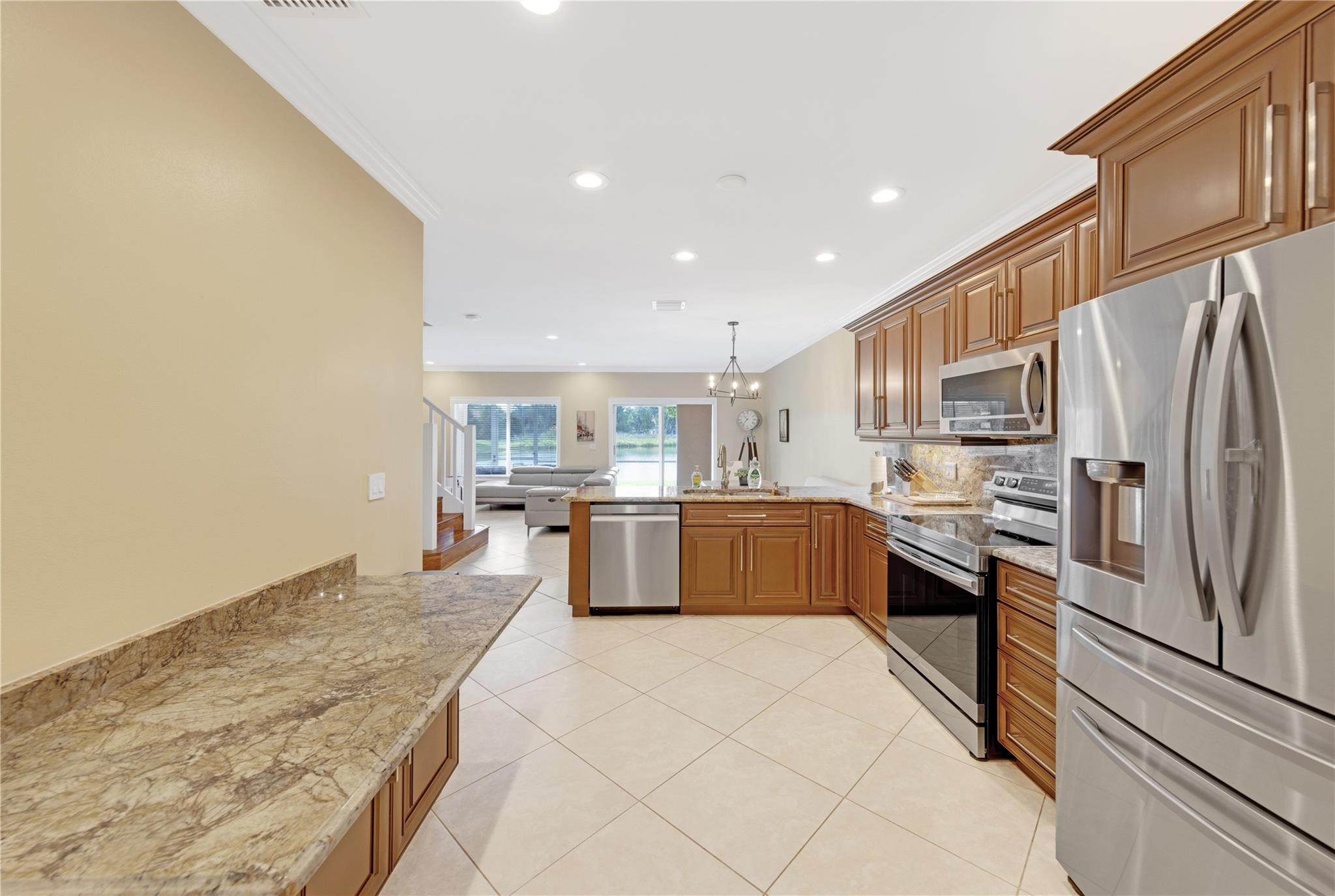 8310 Via Leonessa Boca Raton, FL 33433 - Photo 7 of 29 a large kitchen with a large counter top appliances and cabinets