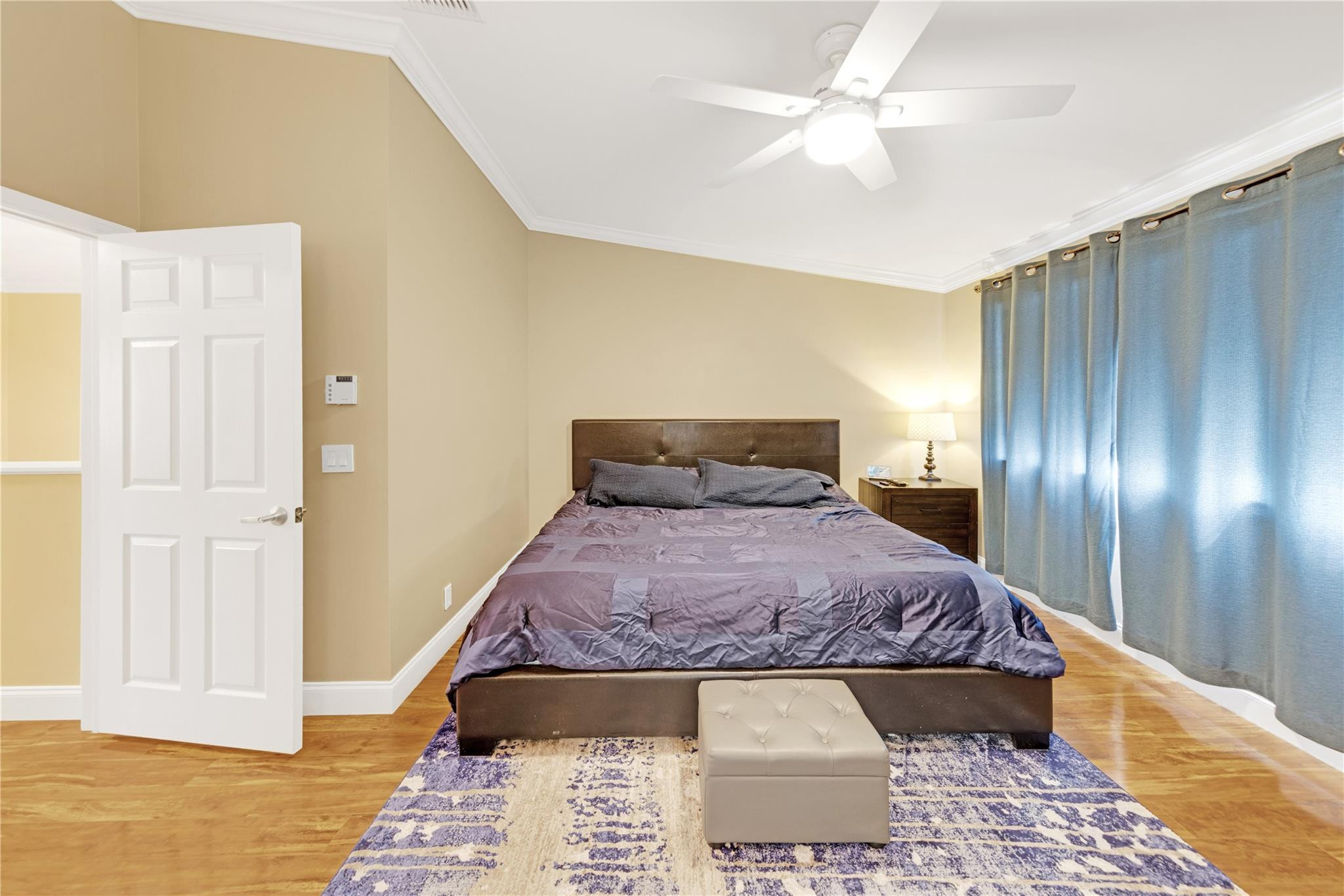 8310 Via Leonessa Boca Raton, FL 33433 - Photo 8 of 29 a bedroom with a bed and wooden floor