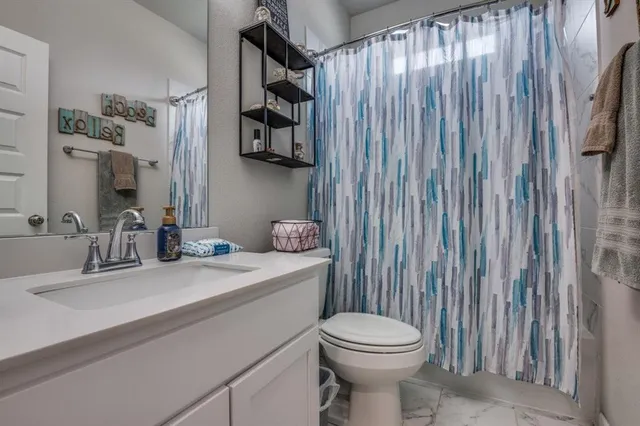 a bedroom with a bed and a tv