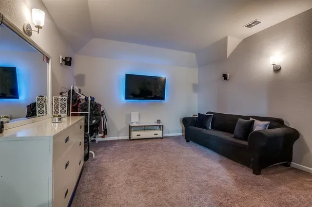 a room with furniture and a flat screen tv