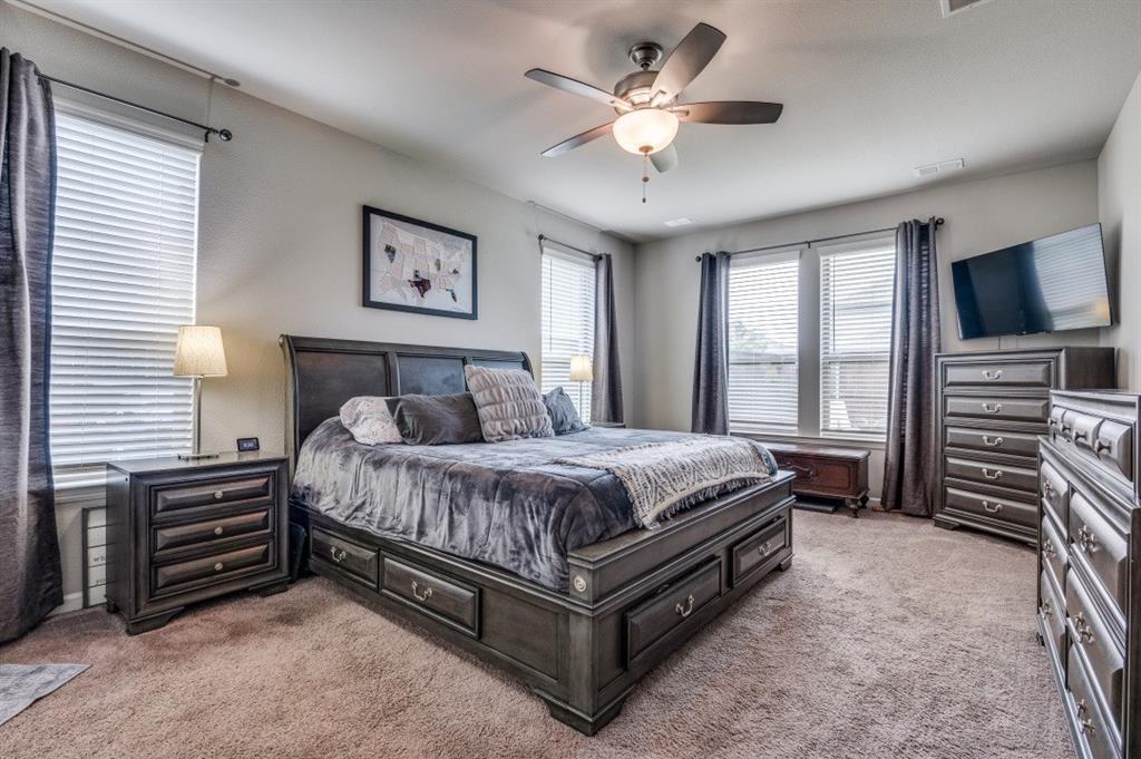 153 Arrow Wood Road Waxahachie, TX 75165 - Photo 9 of 29 Primary bedroom with great natural light and a ceiling fan.