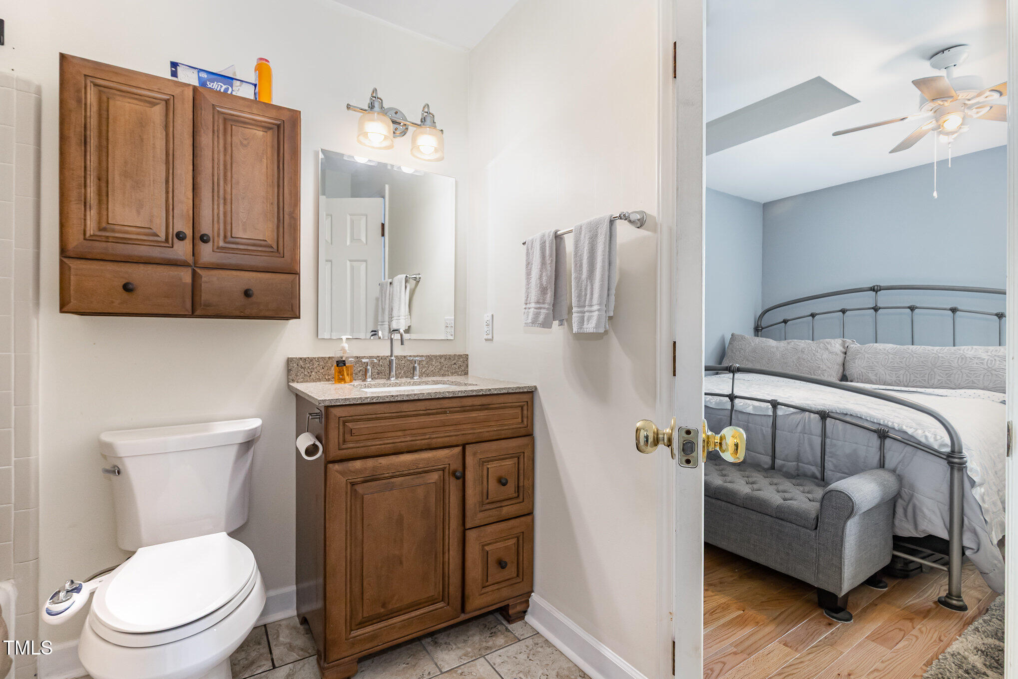 255 Morris Road Pittsboro, NC 27312 - Photo 22 of 40 a bathroom with a toilet a sink and mirror