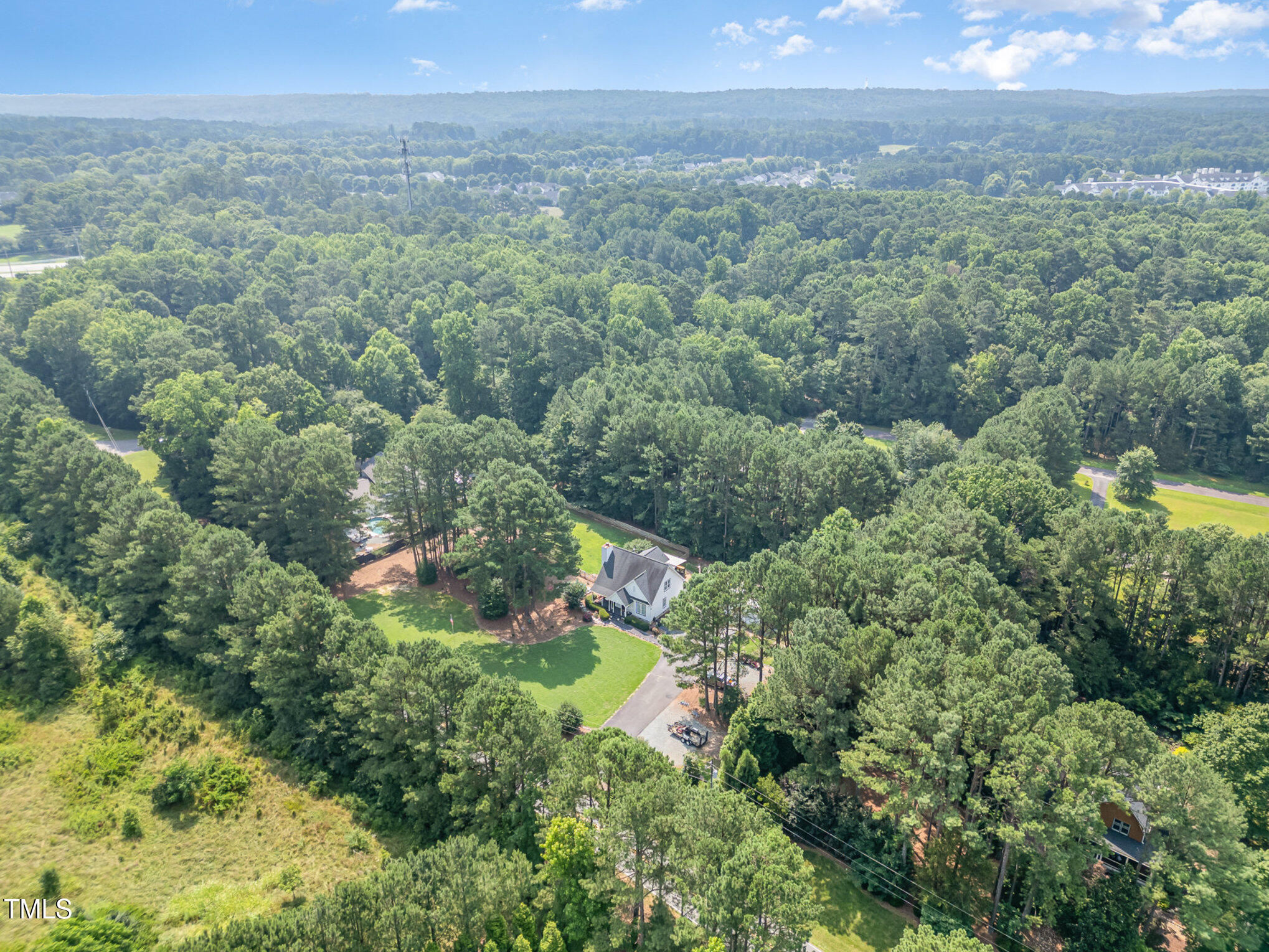 255 Morris Road Pittsboro, NC 27312 - Photo 38 of 40 a view of a forest with a street