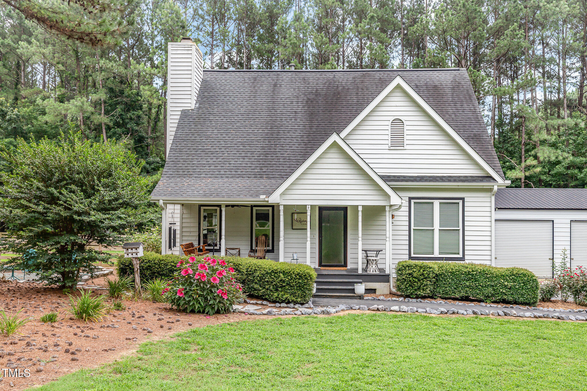255 Morris Road Pittsboro, NC 27312 - Photo 4 of 40 a view of a house with a yard and plants