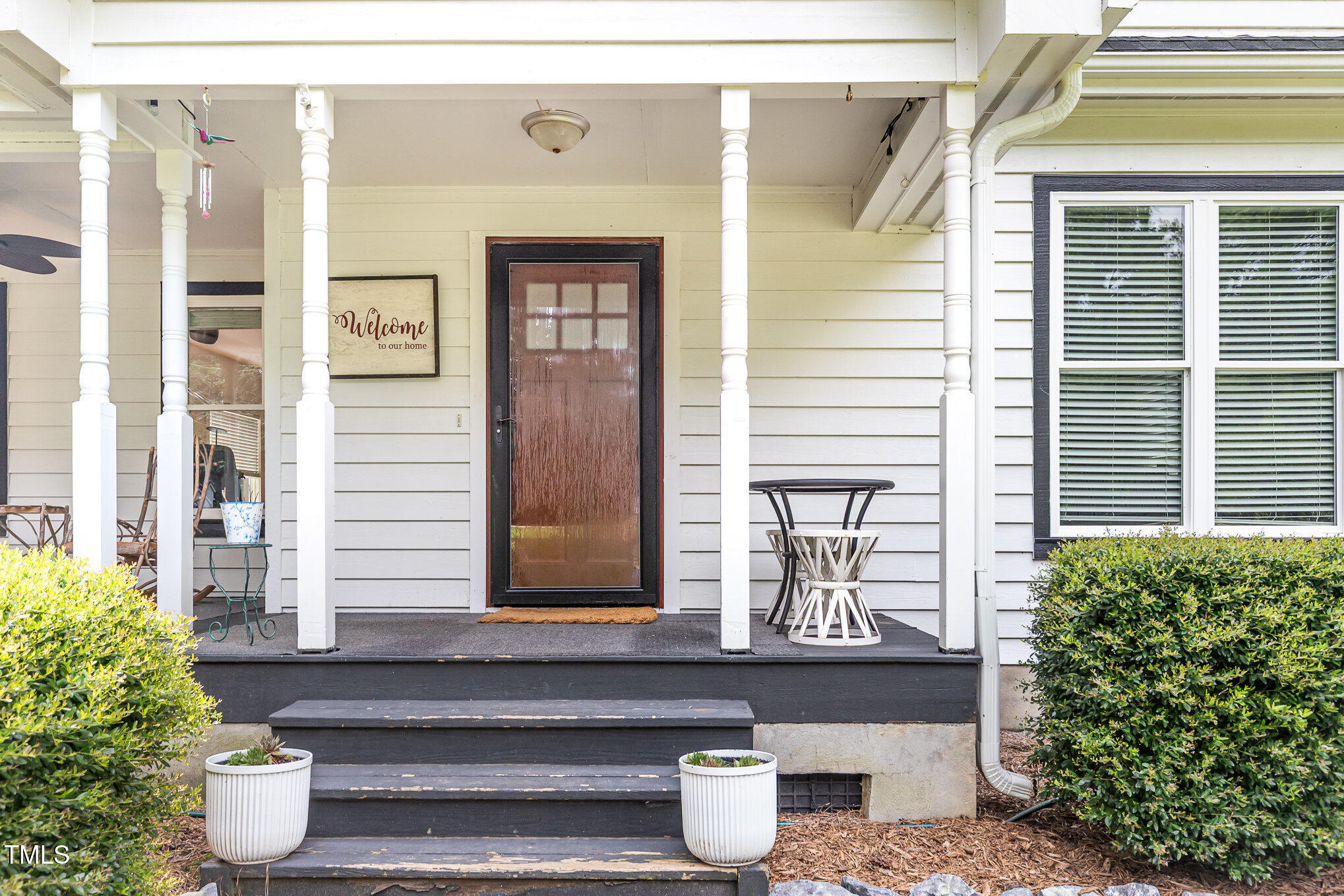 255 Morris Road Pittsboro, NC 27312 - Photo 5 of 40 a front view of a house with outdoor seating