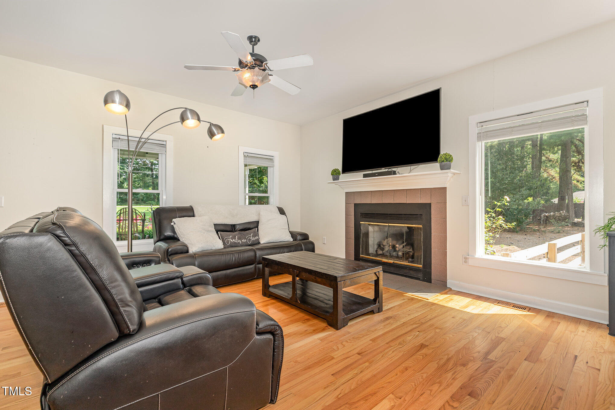 255 Morris Road Pittsboro, NC 27312 - Photo 8 of 40 a living room with furniture fireplace and flat screen tv