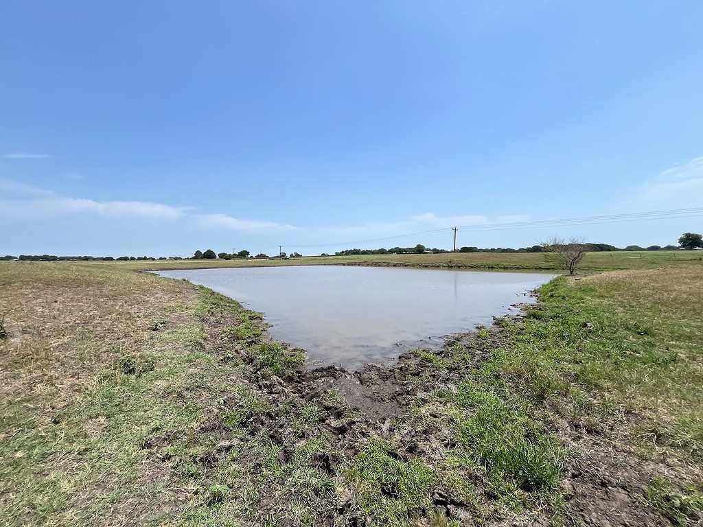 Tbd West Sedan Road Weimar, TX 78962 - Photo 7 of 10 a view of a lake with houses in the back