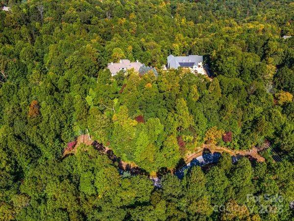 a backyard of a house with lots of green space and wooden floor
