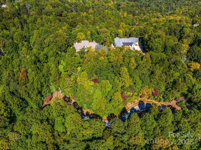a backyard of a house with lots of green space and wooden floor