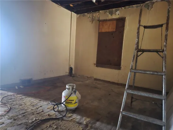 a view of a room with wooden floor