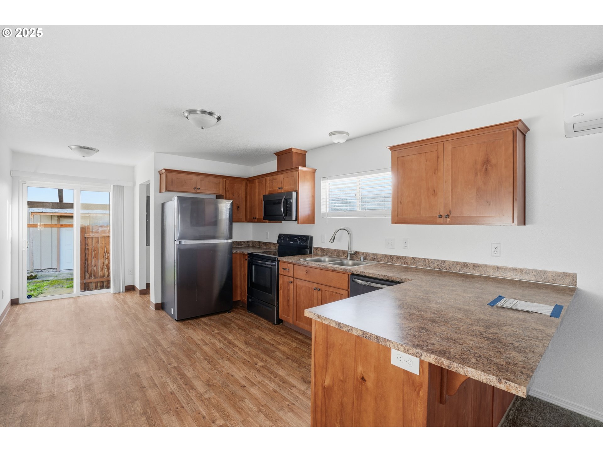 344 Douglas Street Longview, WA 98632 - Photo 11 of 29 a kitchen with stainless steel appliances granite countertop a sink refrigerator and cabinets