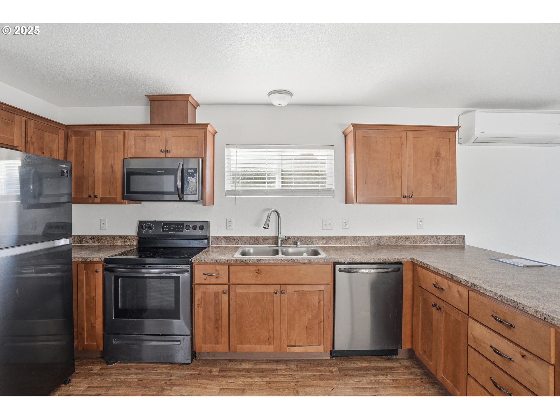 344 Douglas Street Longview, WA 98632 - Photo 12 of 29 a kitchen with a sink a stove and cabinets