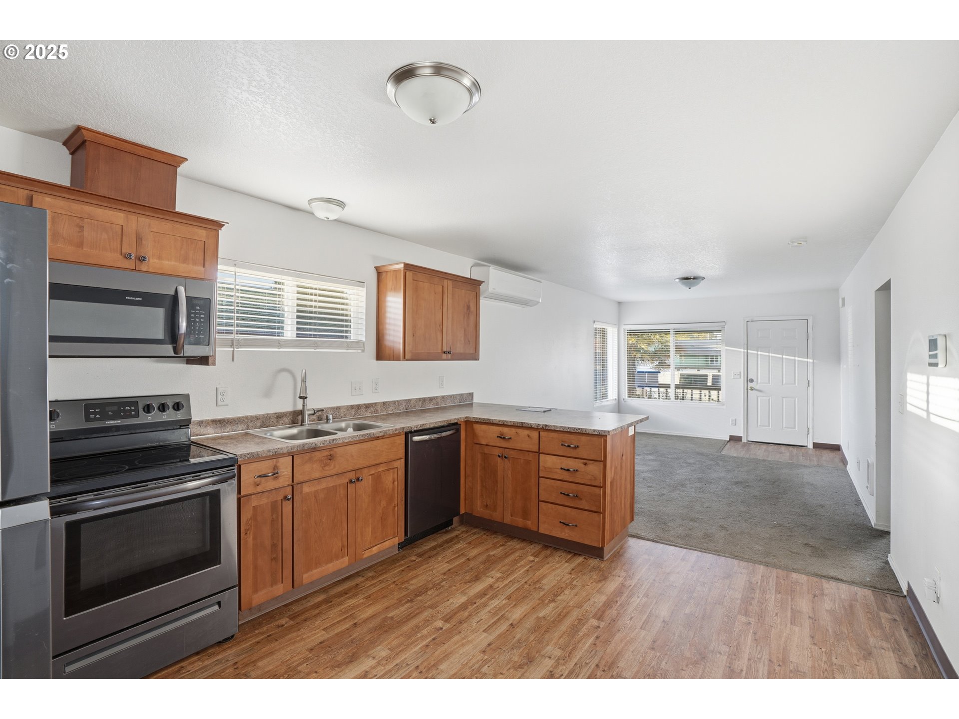 344 Douglas Street Longview, WA 98632 - Photo 13 of 29 a kitchen with stainless steel appliances granite countertop a stove top oven a sink dishwasher and wooden cabinets