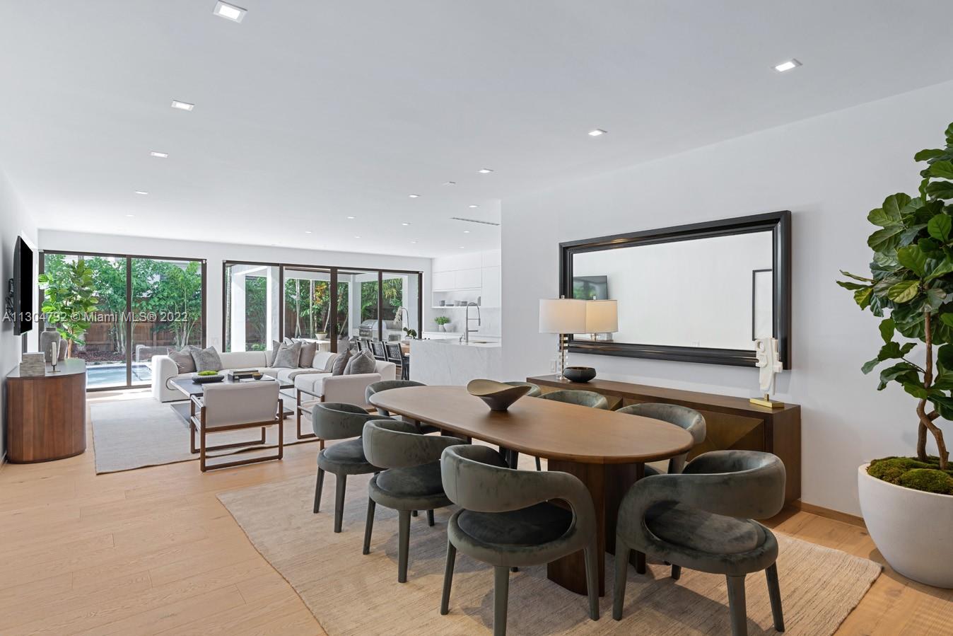 10 Pinta Road Miami, FL 33133 - Photo 12 of 52 a dining room with furniture and wooden floor