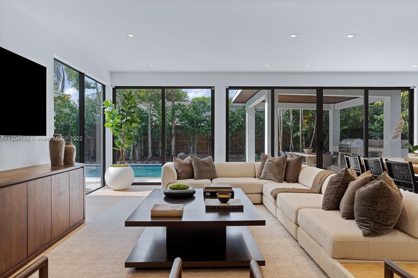 10 Pinta Road Miami, FL 33133 - Photo 13 of 52 a living room with furniture and a flat screen tv