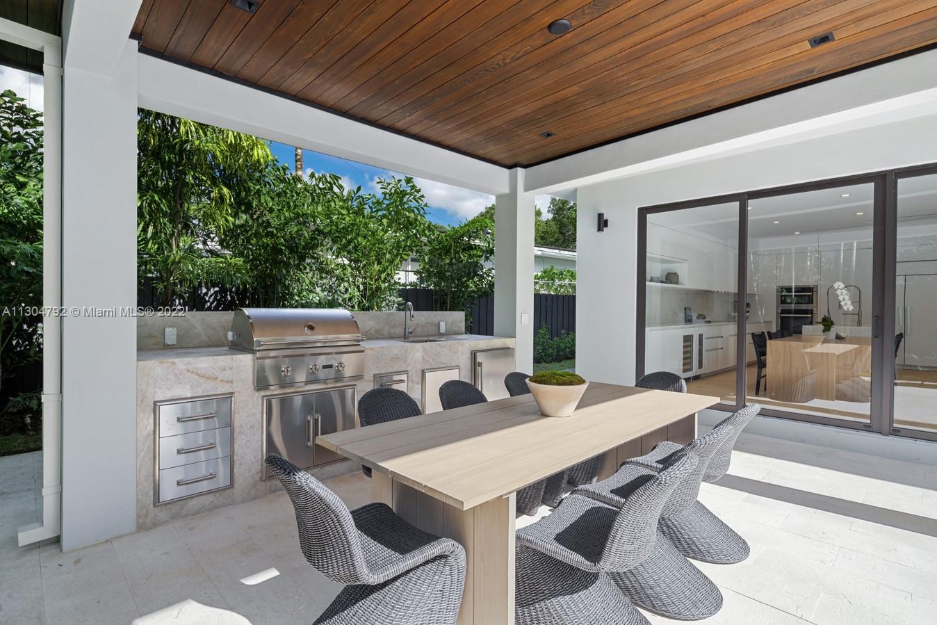 10 Pinta Road Miami, FL 33133 - Photo 2 of 52 a view of an outdoor dining space with furniture