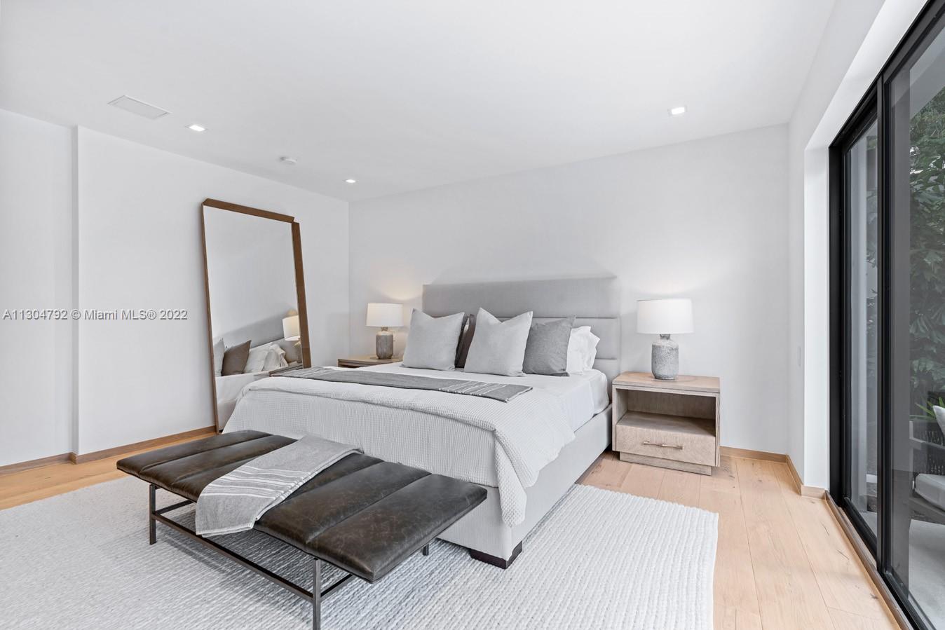 10 Pinta Road Miami, FL 33133 - Photo 36 of 52 a bedroom with a bed and a dresser