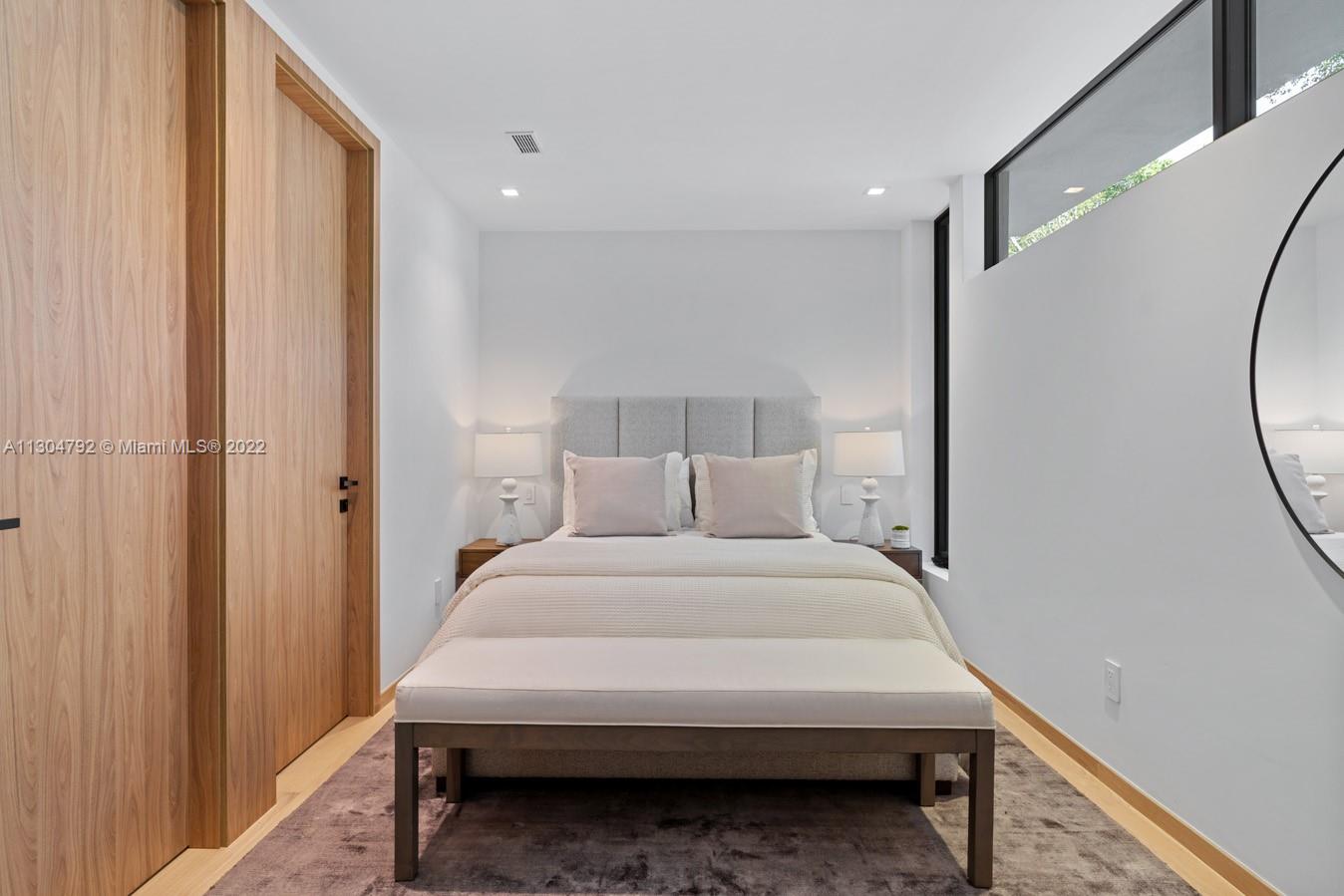 10 Pinta Road Miami, FL 33133 - Photo 40 of 52 a bed room with a bed and a mirror