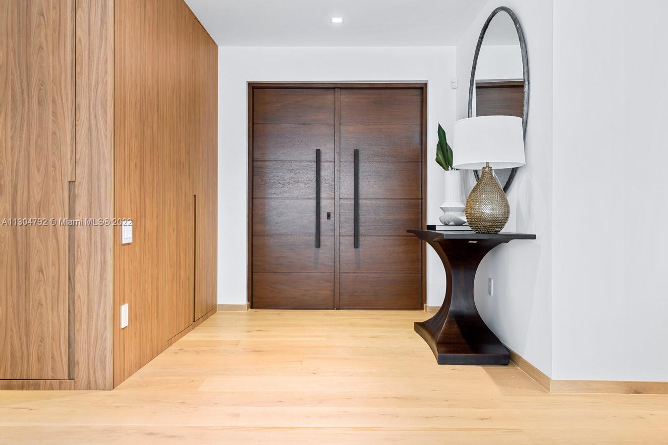 10 Pinta Road Miami, FL 33133 - Photo 52 of 52 a view of a hallway with wooden floor and entryway