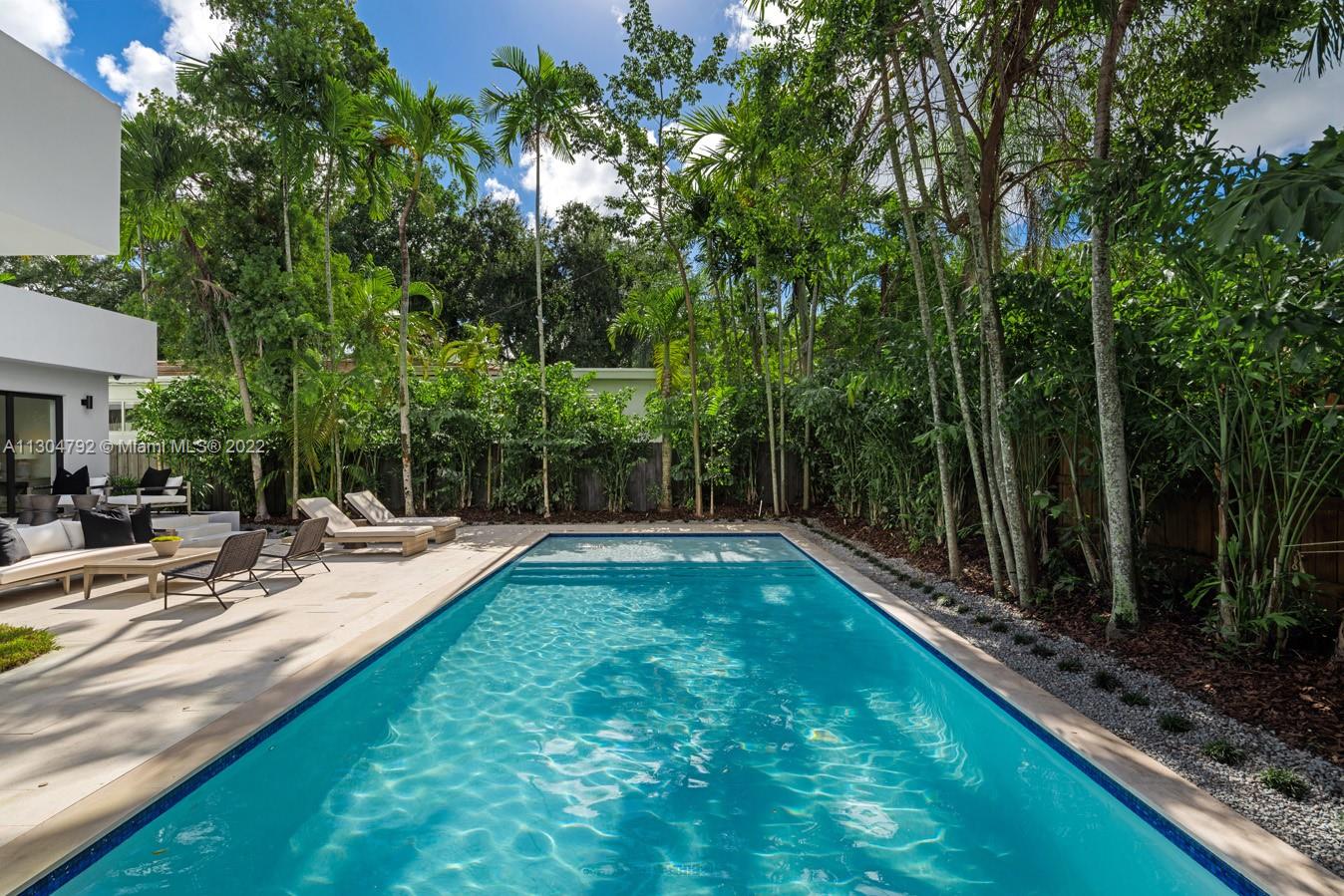 10 Pinta Road Miami, FL 33133 - Photo 10 of 52 a view of a backyard with swimming pool