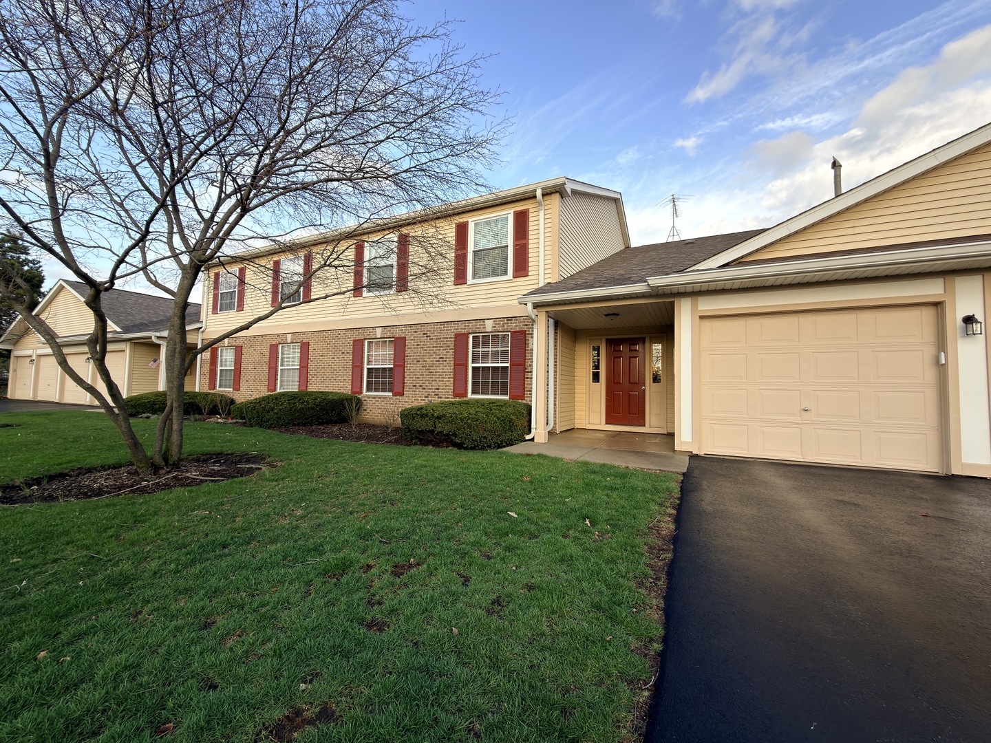 400 Woodview Circle, Unit A Elgin, IL 60120 - Photo 1 of 40 front view of a house with a yard