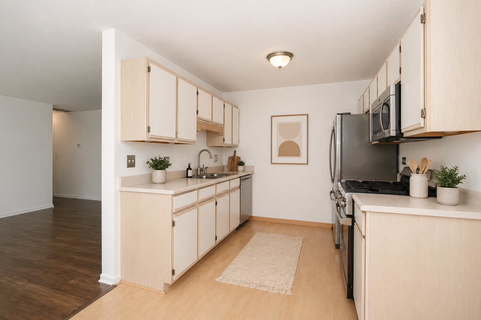 400 Woodview Circle, Unit A Elgin, IL 60120 - Photo 11 of 40 a kitchen with stainless steel appliances granite countertop a sink a stove and a refrigerator