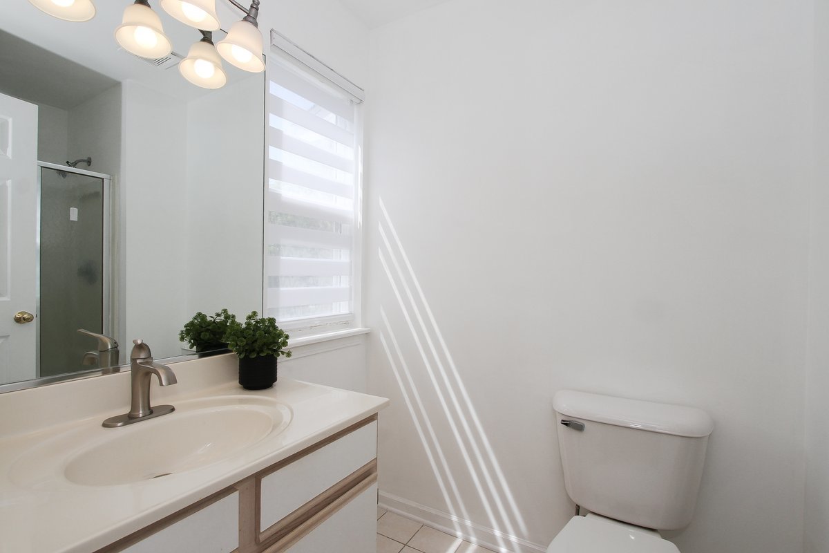 400 Woodview Circle, Unit A Elgin, IL 60120 - Photo 22 of 40 a bathroom with a sink toilet and tub