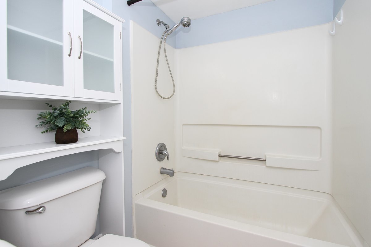 400 Woodview Circle, Unit A Elgin, IL 60120 - Photo 29 of 40 a bathroom with a shower and a bathtub