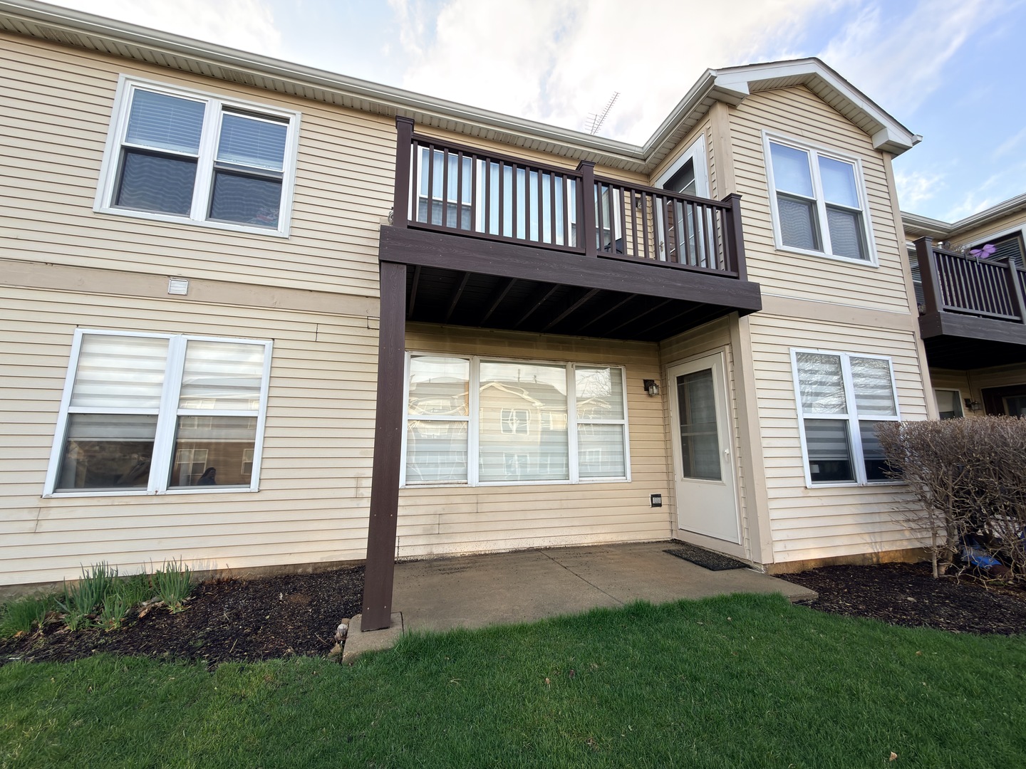 400 Woodview Circle, Unit A Elgin, IL 60120 - Photo 36 of 40 a view of a house with a yard and wooden deck