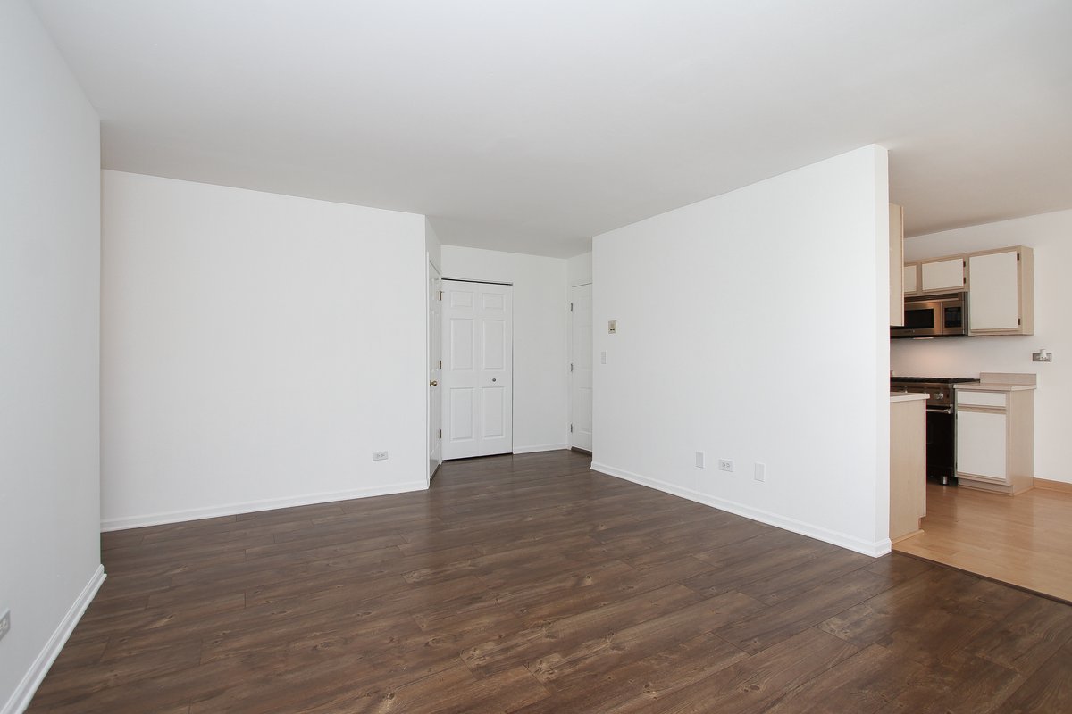 400 Woodview Circle, Unit A Elgin, IL 60120 - Photo 8 of 40 a view of empty room with wooden floor