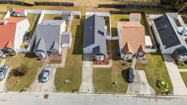an aerial view of residential houses with outdoor space