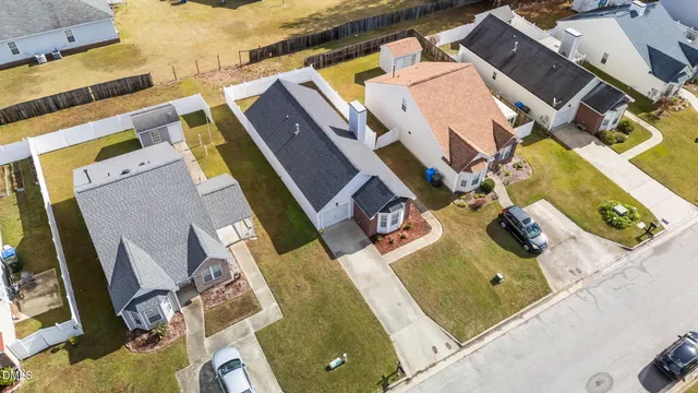 an aerial view of a house with a swimming pool