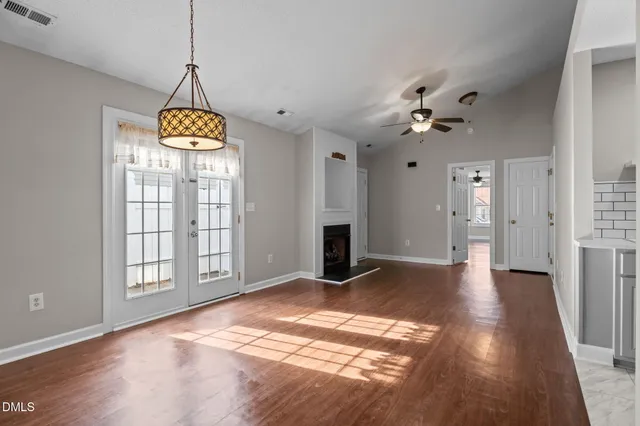 a view of an empty room with a window