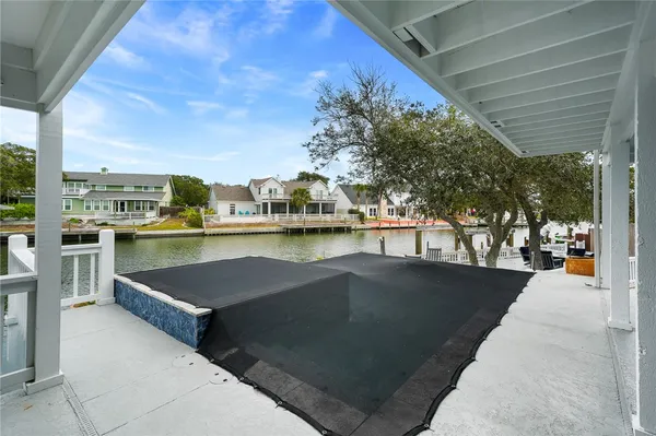 a view of a swimming pool with a lawn chairs