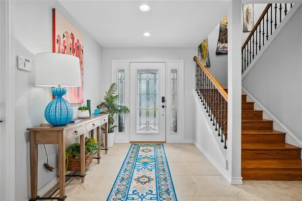 a hallway with furniture and a book shelf