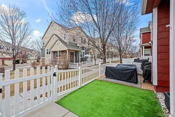 a front view of a house with garden and deck