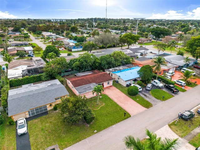 an aerial view of a house with a garden