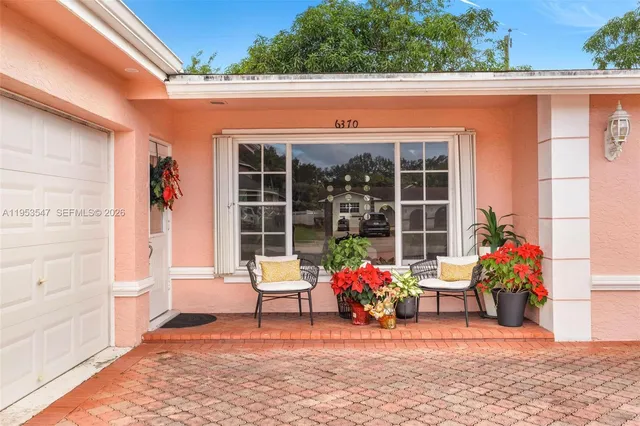 a view of a chairs in front of a house