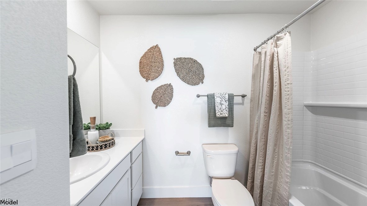 5861 Morgan Horse Street Reno, NV 89523 - Photo 11 of 15 a bathroom with a toilet sink and mirror