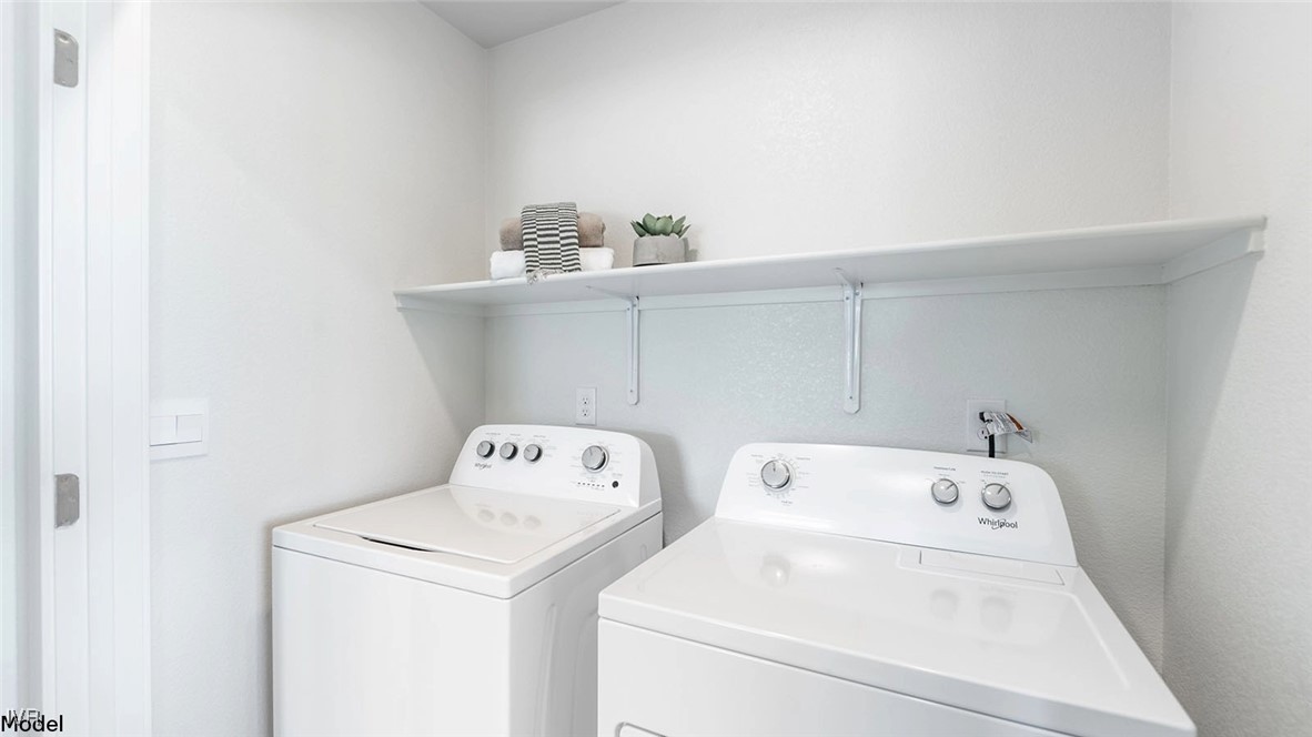 5861 Morgan Horse Street Reno, NV 89523 - Photo 15 of 15 a utility room with dryer and washer
