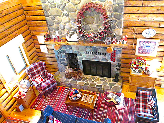 6210 Mountain View Road, Unit 133 Coalville, UT 84017 - Photo 18 of 87 A two-story fireplace made of gray river rock from American Fork Canyon, has a log niche, a raised hearth, and a log mantle. There is an electric blower to warm the main floor.