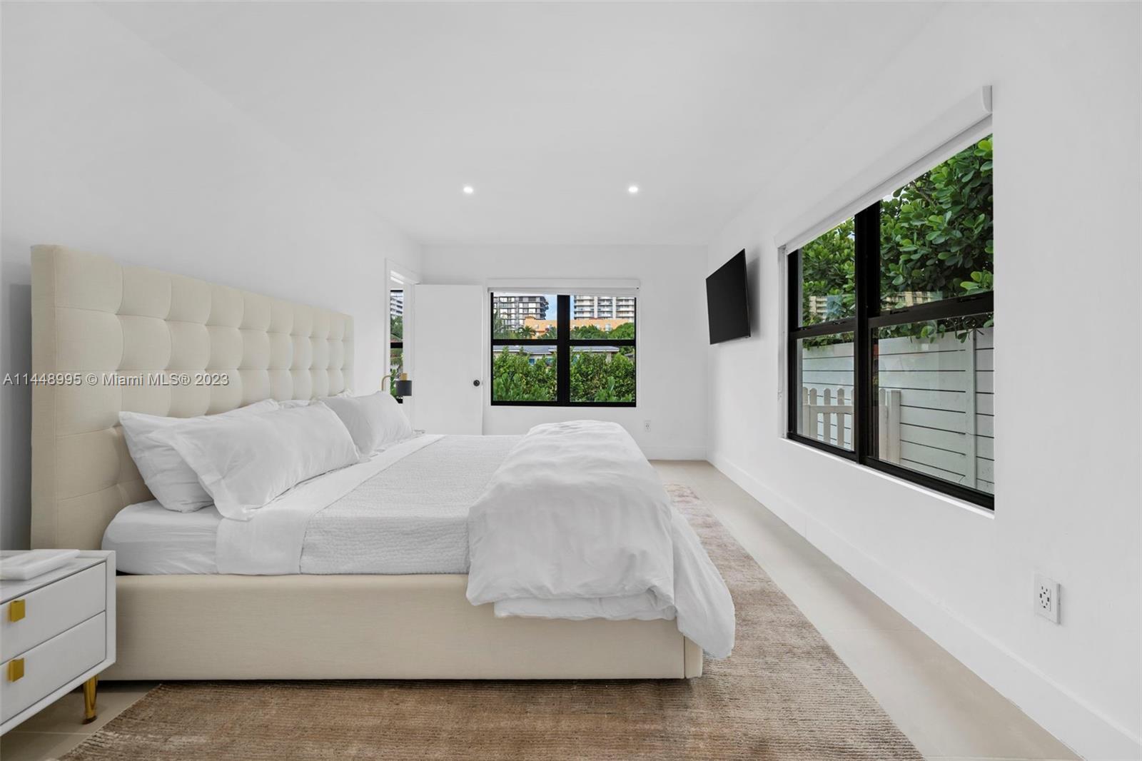 8844 Abbott Avenue Surfside, FL 33154 - Photo 4 of 11 a living room with furniture and a large window